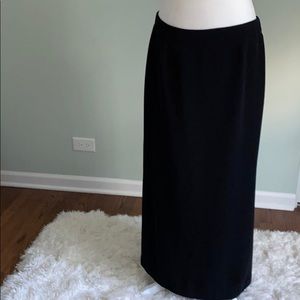Long black skirt with the cut on the side.